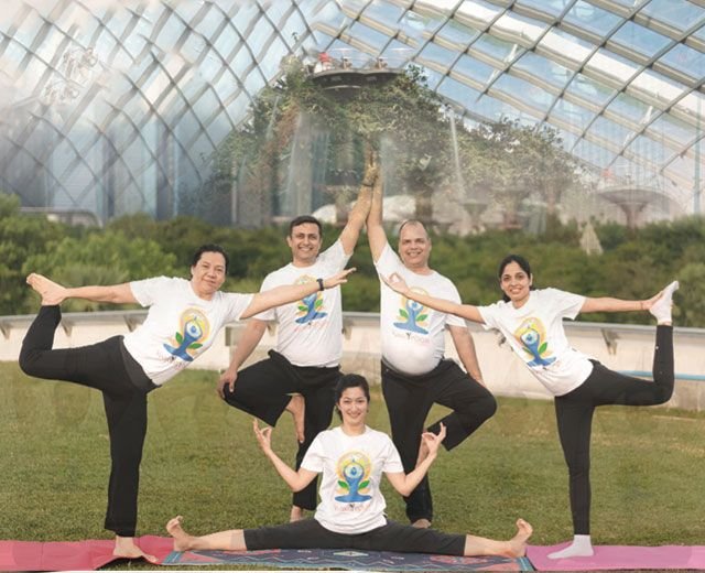 APYTA members practising yoga in Singapore